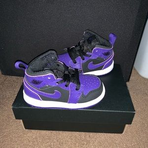 Black and purple Jordan 1s